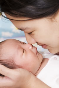 mom holding baby